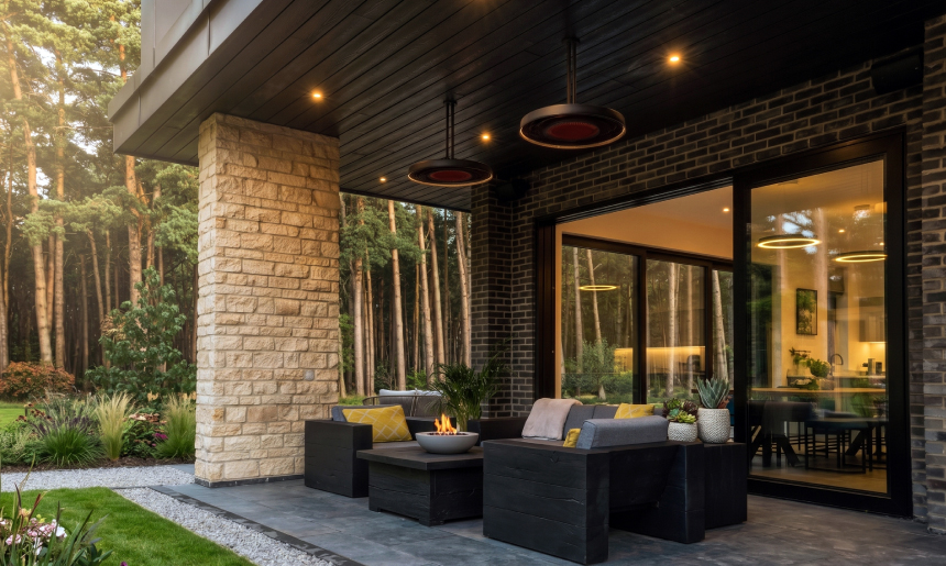 Bromic Eclipse Series pendant patio heaters above a covered outdoor lounge